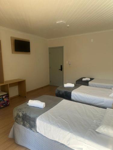 Cama o camas de una habitación en Unity Hotel - Votorantim - SP