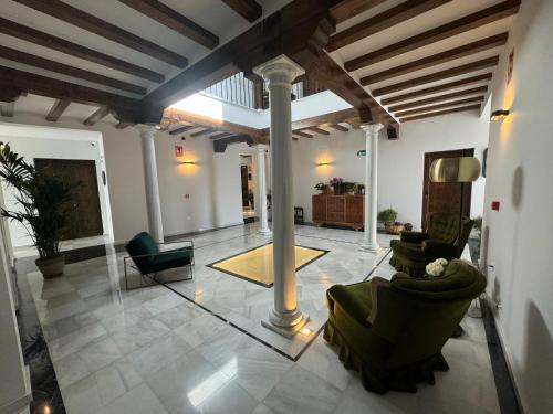 a large living room with couches and chairs at CASA YANGUAS APARTAMENTOS RURALES EN LAUJAR DE ANDARAx in Laujar de Andarax