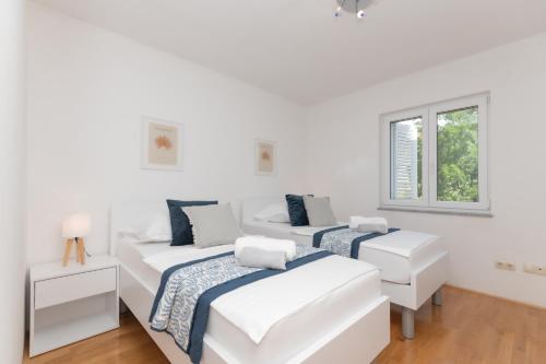Postel nebo postele na pokoji v ubytování Apartman Maria