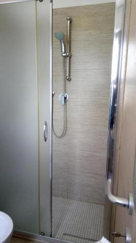 a shower with a glass door in a bathroom at Hotel Meeting in Bellaria-Igea Marina