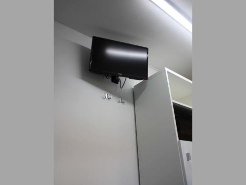 Televízia a/alebo spoločenská miestnosť v ubytovaní Tutti Apartman 2
