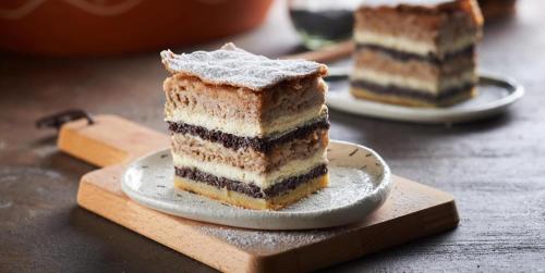 a piece of cake on a plate on a table at Goričko view house in Križevci