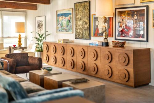 a living room with a couch and a table at Otis Harbor Springs in Harbor Springs