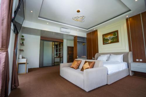 Ένα ή περισσότερα κρεβάτια σε δωμάτιο στο Nirvana Hotel Resort Tetebatu