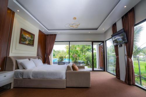 Ένα ή περισσότερα κρεβάτια σε δωμάτιο στο Nirvana Hotel Resort Tetebatu