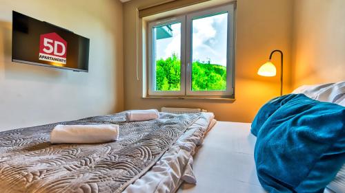 Posteľ alebo postele v izbe v ubytovaní Apartament Górzysty blisko Elementsa- 5D Apartments