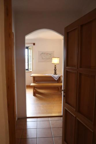 an open door to a room with a bench in it at Dům u Giordanu in Slavonice