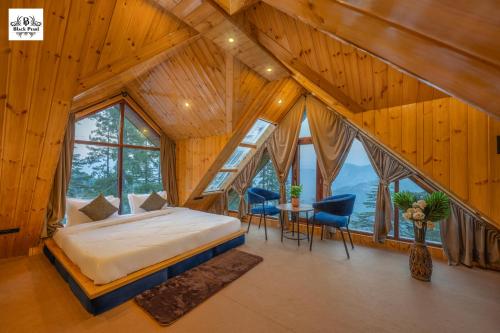 Postel nebo postele na pokoji v ubytování BlackPearl Cottage - Kufri