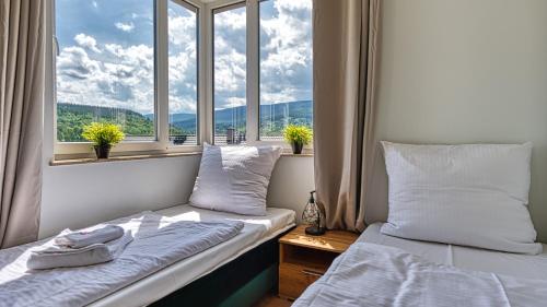 Posteľ alebo postele v izbe v ubytovaní Apartament Winter Feel z prywatną SAUNĄ - 5D Apartments