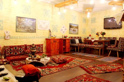 a living room with a couch and a table at Sebilhan Apart Hotel in Sarajevo