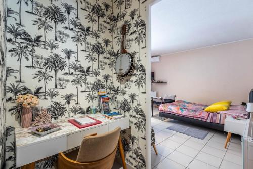 Ένα ή περισσότερα κρεβάτια σε δωμάτιο στο Mon Appart avec Terrasse et Piscine