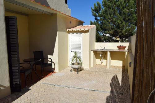 a patio with a table and a table in a house at Family House in Lagos