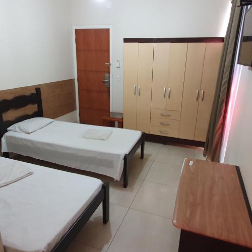 Katil atau katil-katil dalam bilik di Hotel Muriaé