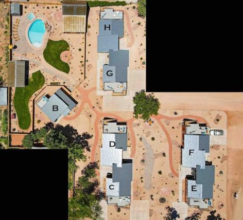 an aerial view of a yard with houses and a pool at Timber & Tin G 2Bed 2Bath w Pool & Rooftop Deck in Kanab
