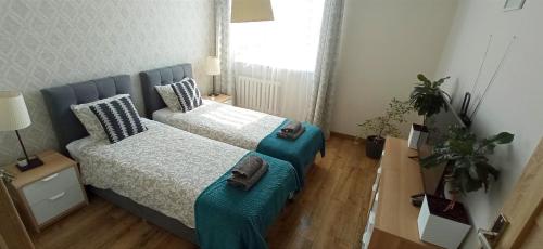 Ліжко або ліжка в номері VIP Apartments - Apartamenty na Szewskiej