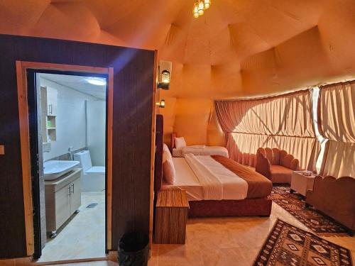 En eller flere senge i et værelse på Star Camp