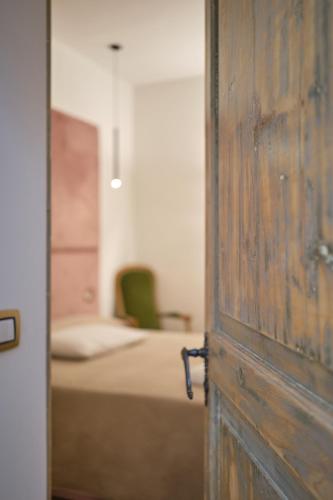 Ένα ή περισσότερα κρεβάτια σε δωμάτιο στο Makó House - in centro città