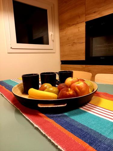 a plate of fruits and vegetables on a table at B&B La dolce Vite in Medea