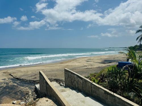 a view of a beach with the ocean at New! Mini Casa de Playa in Arecibo