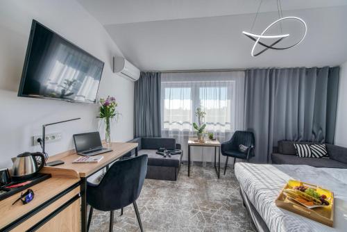 Μια τηλεόραση ή/και κέντρο ψυχαγωγίας στο Acodomo Apartamenty
