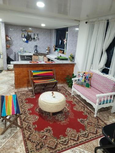 a living room with a couch and a table at Casa Puente de Boyaca in Tunja