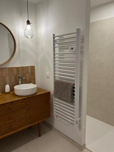 a bathroom with a sink and a mirror at Gite d'exception en pleine nature in Prémanon