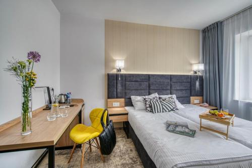 Ένα ή περισσότερα κρεβάτια σε δωμάτιο στο Acodomo Apartamenty