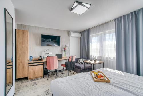 Μια τηλεόραση ή/και κέντρο ψυχαγωγίας στο Acodomo Apartamenty