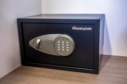 a television with a remote control in a box at Marina Cerritos Loft Wave Pool and Amenities in Mazatlán