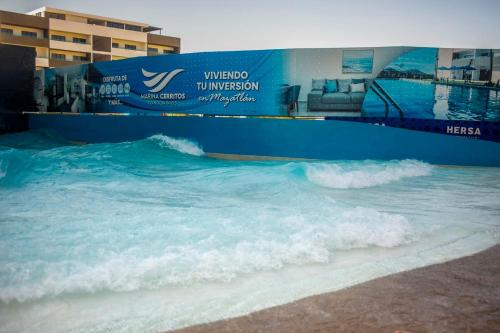 a wave in the water at a water park at Marina Cerritos Loft Wave Pool and Amenities in Mazatlán