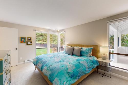 a bedroom with a large bed and a window at Morning Star Retreat in Vashon