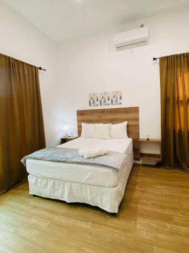 a bedroom with a large bed in a room at Casa Victoria in Flores