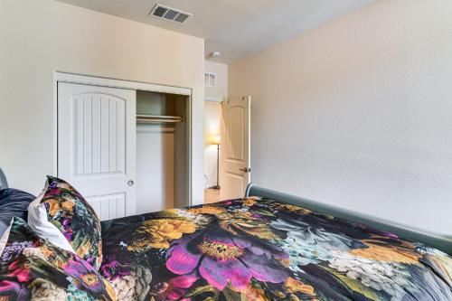 a bedroom with a bed with a colorful blanket at 16 Mi to Lake Tahoe Carson City Townhome in Carson City