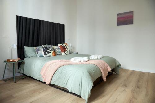 a bedroom with a bed with a teddy bear on it at Casa Colombo in Grosseto