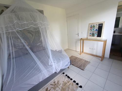 Postel nebo postele na pokoji v ubytování Kay Ti Colibri