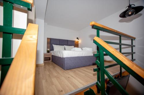 a bedroom with a bunk bed and a ladder at Sophia seaview suites & restaurant in Nea Vrasna