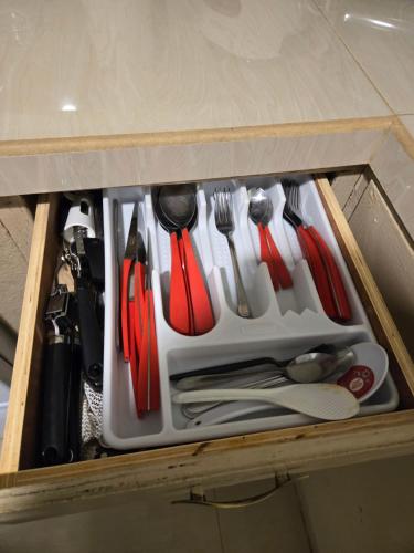 a drawer filled with utensils in a cabinet at 2Bed1Bath - Central Island Haven in Sinajana