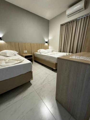Postel nebo postele na pokoji v ubytování Hotel Minorus