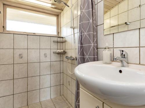 a bathroom with a sink and a shower at 6 person holiday home in Storvorde in Storvorde