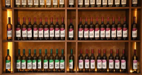 a bunch of wine bottles on a shelf at KOKINO Winery & Hotel in Kumanovo