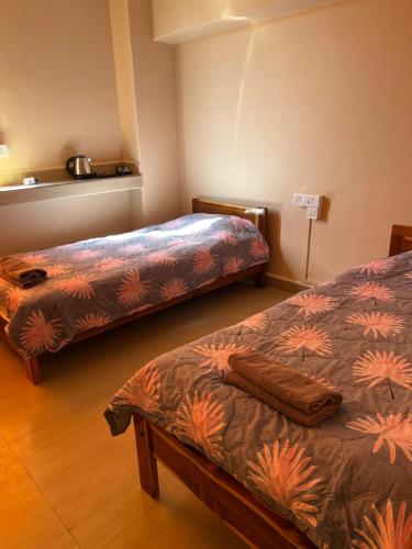 Postel nebo postele na pokoji v ubytování Zaras Cottage