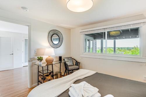 a bedroom with a bed and a window at Elegant Gloucester Beach Getaway with Ocean Views! in Gloucester