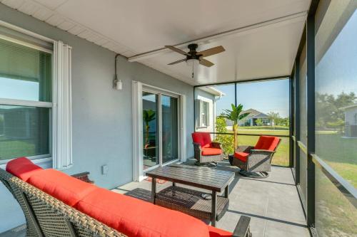 a screened in porch with a couch and chairs at Sunny Abode Less Than 1 Mi to Peace River Preserve! in Port Charlotte
