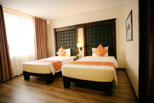 Katil atau katil-katil dalam bilik di Ha Long Park Hotel