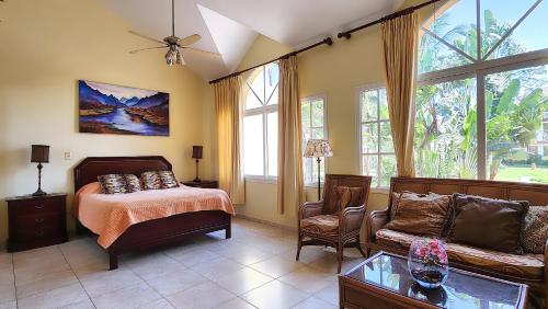 a living room with a bed and a couch at Ocean Dream in Cabarete