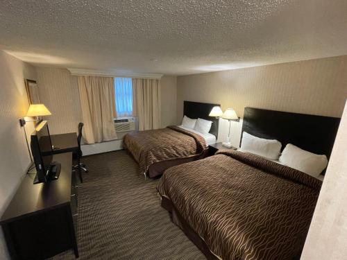 Postel nebo postele na pokoji v ubytování Almac Hotel