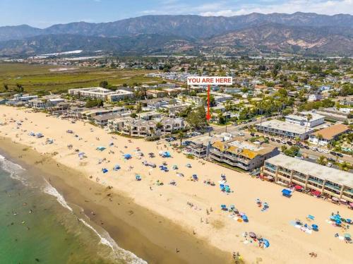 an overhead view of a beach with people and umbrellas at Carpinteria Beach Studio Condo in Carpinteria