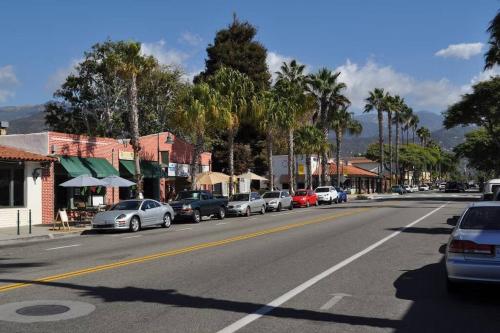 a city street with cars parked on the side of the road at Carpinteria Beach Studio Condo in Carpinteria