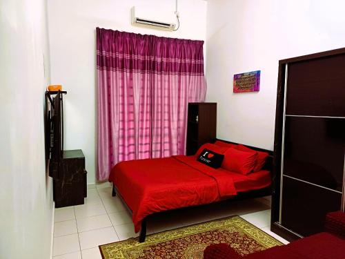 a bedroom with a red bed and a pink window at Kuantan Homestay Best Facility Wifi BBQ Viu in Kuantan