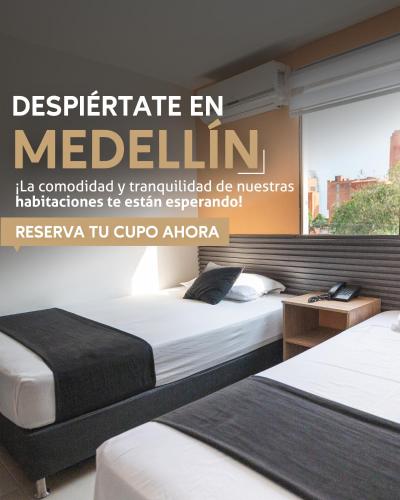 a bedroom with two beds and a sign that reads perpetuate en mellem at HOTEL ESTADIO DORADO in Medellín